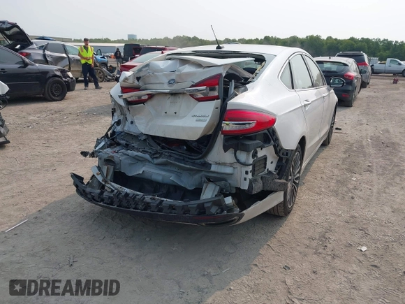 2017 Ford Fusion Titanium z VIN 3FA6P0K92HR396113, wystawiony jako IAAI lot #42402969 z przebiegiem 185 620 mil mil oraz . Historia ofert i sprzedaży dostępna na DreamBid. Obrazek 4.