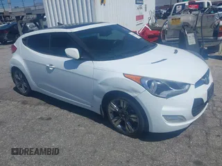 2015 Hyundai Veloster with VIN KMHTC6AD5FU231224, listed as a IAAI auction lot 41944186 with 103,124 mi miles. Bid and sale history available at carsss.com. Image 1.