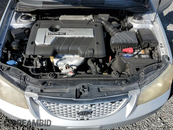 2006 Kia Spectra EX with VIN KNAFE121365229594, listed as a Copart auction lot 77311084 with 129,789 mi miles and Salvage Title. Bid and sale history available at carsss.com. Image 11.