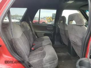 1996 GMC Jimmy SL with VIN 1GKDT13WXT2502347, listed as a Copart auction lot 74502444 with 253,735 mi miles and Salvage Title. Bid and sale history available at carsss.com. Image 11.