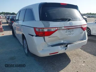 2012 Honda Odyssey Touring with VIN 5FNRL5H93CB125241, listed as a IAAI auction lot 42299053 with 125,549 mi miles and . Bid and sale history available at DreamBid. Image 6.