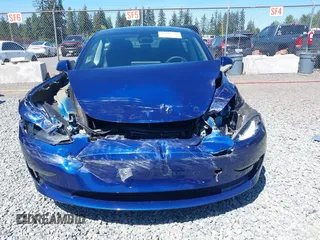 2023 Tesla Model 3 z VIN 5YJ3E1EA9PF639141, wystawiony jako IAAI lot #42167773 z przebiegiem 57 459 mil mil oraz . Historia ofert i sprzedaży dostępna na DreamBid. Obrazek 6.