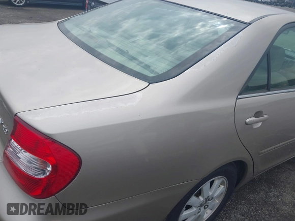 2003 Toyota Camry LE with VIN 4T1BE30K73U248560, listed as a IAAI auction lot 41889516 with 179,961 mi miles and . Bid and sale history available at DreamBid. Image 6.