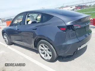 2023 Tesla Model Y Long Range z VIN 7SAYGDEE1PA158661, wystawiony jako IAAI lot #41983897 z przebiegiem 20 176 mil mil oraz . Historia ofert i sprzedaży dostępna na DreamBid. Obrazek 3.