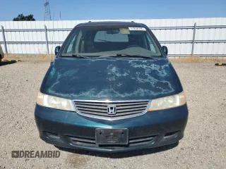2000 Honda Odyssey EX z VIN 2HKRL1867YH587616, wystawiony jako Copart lot #57258795 z przebiegiem 219 999 mil mil oraz Szkoda całkowita • Salvage title. Historia ofert i sprzedaży dostępna na DreamBid. Obrazek 5.