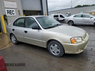 2002 Hyundai Accent GL z VIN KMHCG45C12U355561, wystawiony jako Copart lot #54546945 z przebiegiem 22 893 mil mil oraz Szkody całkowita. Historia ofert i sprzedaży dostępna na DreamBid. Obrazek 4.