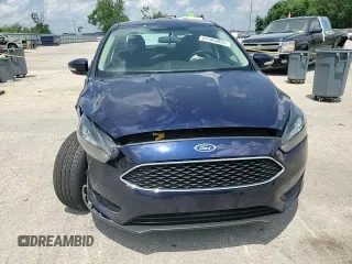 2016 Ford Focus SE z VIN 1FADP3F23GL288232, wystawiony jako Copart lot #62565095 z przebiegiem 11 634 mil mil oraz Szkoda całkowita • Salvage title. Historia ofert i sprzedaży dostępna na DreamBid. Obrazek 13.