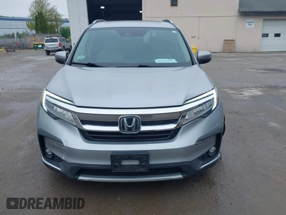 2020 Honda Pilot Touring 8-Passenger z VIN 5FNYF6H91LB042626, wystawiony jako IAAI lot #42249440 z przebiegiem 57 429 mil mil oraz . Historia ofert i sprzedaży dostępna na DreamBid. Obrazek 12.