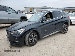 2017 BMW X1 xDrive28i with VIN WBXHT3Z33H4A53584, listed as a Copart auction lot 46030215 with 70,858 mi miles and Salvage Title. Bid and sale history available at carsss.com. Image 1.
