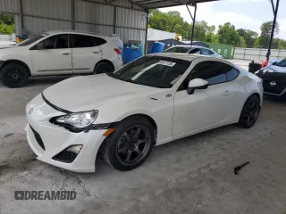2013 Scion FR-S z VIN JF1ZNAA10D2724258, wystawiony jako Copart lot #60417725 z przebiegiem 138 315 mil mil oraz Czysty tytuł • Clean title. Historia ofert i sprzedaży dostępna na DreamBid. Obrazek 1.