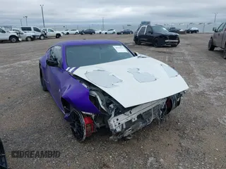 2014 Nissan 370Z Nismo z VIN JN1AZ4EH0EM633035, wystawiony jako IAAI lot #41542036 z przebiegiem 74 337 mil mil oraz . Historia ofert i sprzedaży dostępna na DreamBid. Obrazek 1.