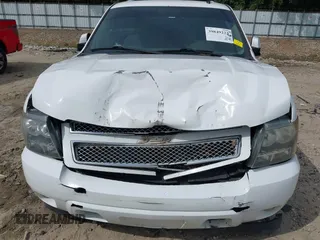 2014 Chevrolet Suburban LT with VIN 1GNSCJE08ER185472, listed as a IAAI auction lot 39849223 with 198,853 mi miles. Bid and sale history available at carsss.com. Image 6.