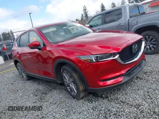2021 Mazda CX-5 Grand Touring with VIN JM3KFBDM4M1455540, listed as a IAAI auction lot 41937166 with 1 mi miles. Bid and sale history available at carsss.com. Image 1.