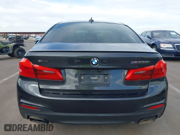 2019 BMW 5 Series M550i xDrive with VIN WBAJB9C51KB287797, listed as a IAAI auction lot 41549311 with 61,459 mi miles and . Bid and sale history available at DreamBid. Image 16.