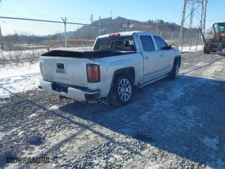 2018 GMC Sierra 1500 Denali with VIN 3GTU2PEC8JG519642, listed as a IAAI auction lot 41427185 with 111,596 mi miles. Bid and sale history available at carsss.com. Image 4.