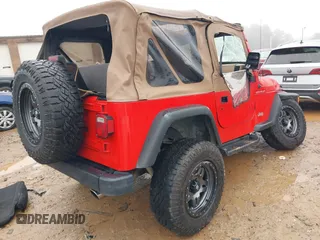 2000 Jeep Wrangler SE with VIN 1J4FA29P7YP793068, listed as a IAAI auction lot 41576287 with 113,298 mi miles. Bid and sale history available at carsss.com. Image 4.