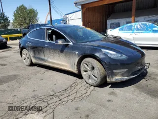 2019 Tesla Model 3 Long Range with VIN 5YJ3E1EB8KF451535, listed as a Copart auction lot 53085105 with 133,928 mi miles and Non Repairable. Bid and sale history available at DreamBid. Image 4.