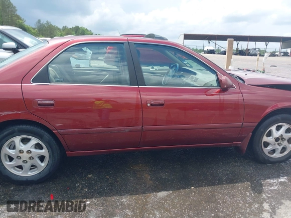 2000 Toyota Camry CE z VIN JT2BG22K3Y0521541, wystawiony jako IAAI lot #42074772 z przebiegiem 144 587 mil mil oraz . Historia ofert i sprzedaży dostępna na DreamBid. Obrazek 13.