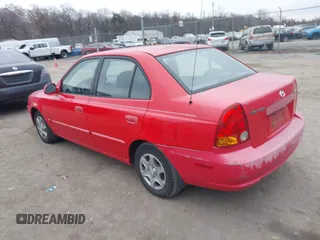 2005 Hyundai Accent GLS with VIN KMHCG45CX5U614083, listed as a IAAI auction lot 41006582 with 72,516 mi miles. Bid and sale history available at carsss.com. Image 3.