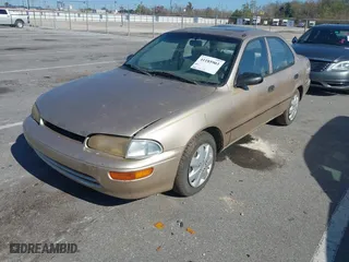 1997 Geo Prizm with VIN 1Y1SK5265VZ460271, listed as a IAAI auction lot 41185903 with 234,015 mi miles. Bid and sale history available at carsss.com. Image 2.