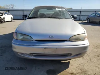 1996 Hyundai Accent z VIN KMHVF14N4TU316378, wystawiony jako Copart lot #88981945 z przebiegiem 128 650 mil mil oraz Tytuł czysty. Historia ofert i sprzedaży dostępna na DreamBid. Obrazek 5.