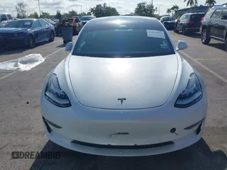 2020 Tesla Model 3 Standard Range Plus with VIN 5YJ3E1EA6LF799620, listed as a IAAI auction lot 42221643 with 55,458 mi miles and . Bid and sale history available at carsss.com. Image 11.