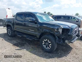 2022 Toyota Tacoma SR with VIN 3TMCZ5ANXNM487044, listed as a IAAI auction lot 42616589 with 58,412 mi miles and . Bid and sale history available at DreamBid. Image 1.