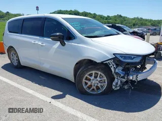 2024 Chrysler Pacifica Touring with VIN 2C4RC1FGXRR124465, listed as a IAAI auction lot 42215299 with 20,407 mi miles and . Bid and sale history available at DreamBid. Image 1.
