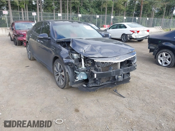 2016 Kia Optima SX Turbo z VIN 5XXGW4L28GG010897, wystawiony jako IAAI lot #42703779 z przebiegiem 121 918 mil mil oraz . Historia ofert i sprzedaży dostępna na DreamBid. Obrazek 1.