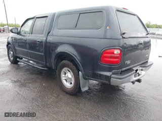 2001 Ford F-150 SuperCrew XLT with VIN 1FTRW07L41KB78053, listed as a IAAI auction lot 41965594 with 303,647 mi miles. Bid and sale history available at carsss.com. Image 3.