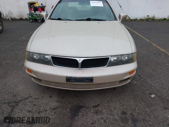 2000 Mitsubishi Diamante LS z VIN 6MMAP67P7YT005234, wystawiony jako IAAI lot #41896098 z przebiegiem 131 852 mil mil oraz . Historia ofert i sprzedaży dostępna na DreamBid. Obrazek 6.