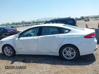 2018 Ford Fusion SE z VIN 3FA6P0LU2JR261268, wystawiony jako IAAI lot #42301578 z przebiegiem 63 357 mil mil oraz . Historia ofert i sprzedaży dostępna na DreamBid. Obrazek 14.