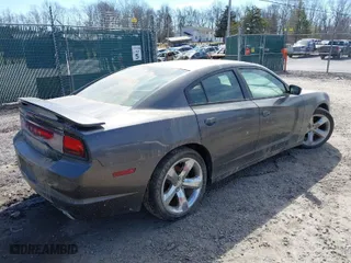 2013 Dodge Charger SE with VIN 2C3CDXBG1DH655150, listed as a IAAI auction lot 41667689 with 131,076 mi miles. Bid and sale history available at carsss.com. Image 4.