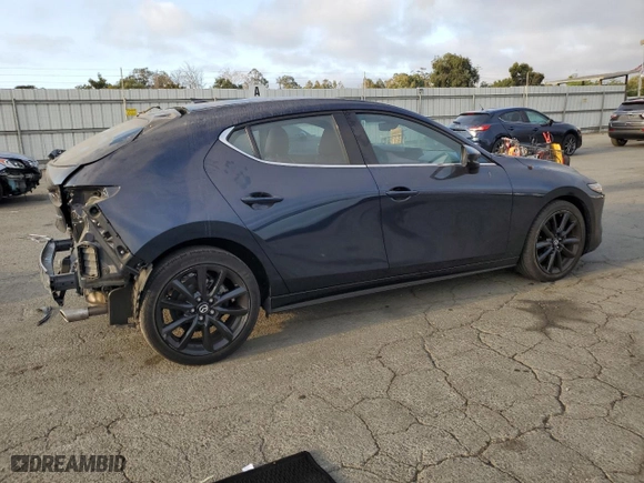 2020 Mazda Mazda3 Hatchback Premium Package with VIN JM1BPANM2L1152849, listed as a Copart auction lot 69611404 with 64,871 mi miles and Salvage Title. Bid and sale history available at carsss.com. Image 3.