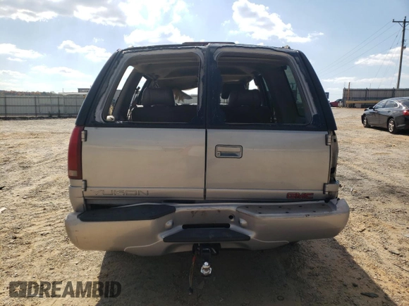 2000 GMC Denali z VIN 1GKEK13R2YR138523, wystawiony jako Copart lot #77609804 z przebiegiem 203 514 mil mil oraz Szkody całkowita. Historia ofert i sprzedaży dostępna na DreamBid. Obrazek 6.