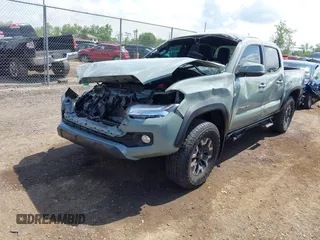 2023 Toyota Tacoma SR with VIN 3TMCZ5AN1PM581266, listed as a IAAI auction lot 42371395 with 32,582 mi miles and . Bid and sale history available at DreamBid. Image 2.