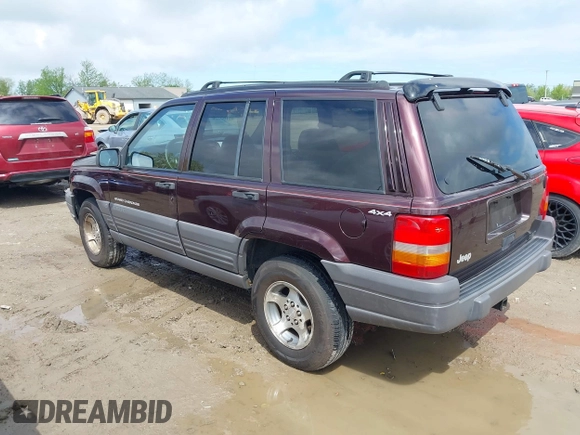 1997 Jeep Grand Cherokee Laredo with VIN 1J4GZ58S4VC702040, listed as a IAAI auction lot 42165536 with 121,803 mi miles and . Bid and sale history available at DreamBid. Image 3.