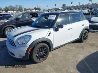 2014 MINI Countryman with VIN WMWZB3C59EWR40065, listed as a IAAI auction lot 40838816 with 80,000 mi miles and . Bid and sale history available at DreamBid. Image 2.