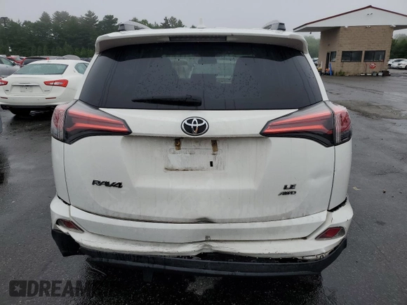2018 Toyota RAV4 LE with VIN 2T3BFREV2JW853108, listed as a Copart auction lot 61245795 with 174,196 mi miles and Salvage title. Bid and sale history available at DreamBid. Image 6.