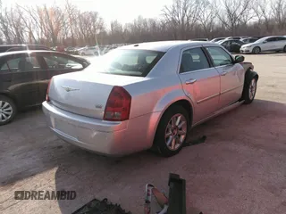 2007 Chrysler 300 Touring with VIN 2C3LA53G57H785979, listed as a IAAI auction lot 36241614 with 220,841 mi miles. Bid and sale history available at carsss.com. Image 4.