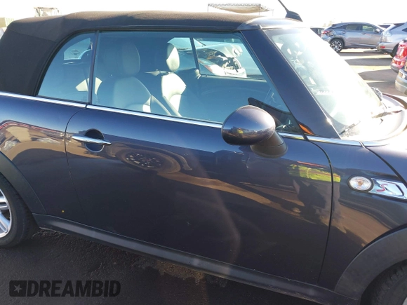 2012 MINI Convertible S with VIN WMWZP3C53CT550336, listed as a IAAI auction lot 40857283 with 51,111 mi miles and . Bid and sale history available at DreamBid. Image 14.