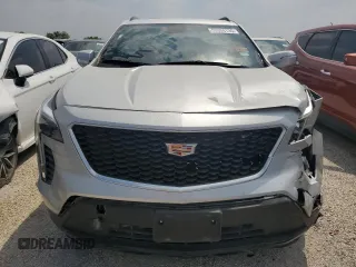 2022 Cadillac XT4 FWD Sport with VIN 1GYFZER47NF111047, listed as a Copart auction lot 50958135 with 14,448 mi miles and Salvage Title. Bid and sale history available at carsss.com. Image 5.
