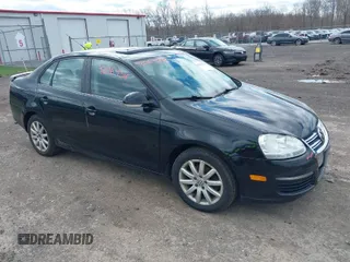 2009 Volkswagen Jetta z VIN 3VWHZ71K39M133909, wystawiony jako IAAI lot #42064318 z przebiegiem 123 107 mil mil oraz . Historia ofert i sprzedaży dostępna na DreamBid. Obrazek 1.