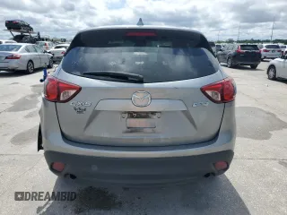 2014 Mazda CX-5 Sport with VIN JM3KE2BE1E0402185, listed as a Copart auction lot 52313675 with 140,398 mi miles and Salvage Title. Bid and sale history available at carsss.com. Image 6.