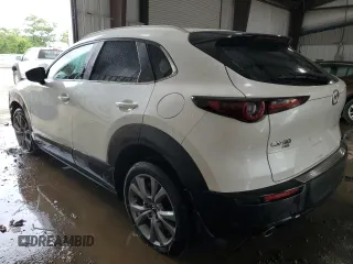 2023 Mazda CX-30 S Select z VIN 3MVDMBBM2PM521471, wystawiony jako Copart lot #63272965 z przebiegiem 26 879 mil mil oraz Szkoda całkowita • Salvage title. Historia ofert i sprzedaży dostępna na DreamBid. Obrazek 2.