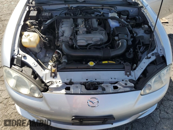 2003 Mazda MX-5 Miata Cloth z VIN JM1NB353430301685, wystawiony jako Copart lot #48756715 z przebiegiem 57 414 mil mil oraz Szkoda całkowita • Salvage title. Historia ofert i sprzedaży dostępna na DreamBid. Obrazek 13.