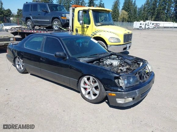 2000 Lexus LS 400 with VIN JT8BH28F8Y0168386, listed as a IAAI auction lot 42063155 with 1 mi miles. Bid and sale history available at carsss.com. Image 1.