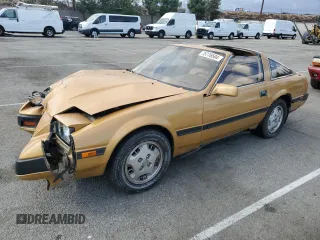 1985 Nissan 300ZX z VIN JN1HZ14S9FX099432, wystawiony jako Copart lot #75776504 z przebiegiem 180 736 mil mil oraz Szkoda całkowita • Salvage title. Historia ofert i sprzedaży dostępna na DreamBid. Obrazek 1.