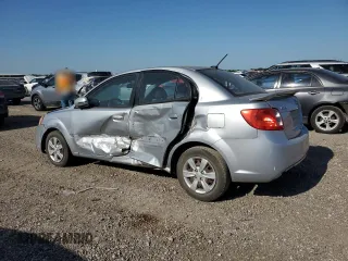 2011 Kia Rio LX with VIN KNADH4A37B6954946, listed as a Copart auction lot 52342385 with 151,984 mi miles and Salvage Title. Bid and sale history available at carsss.com. Image 2.