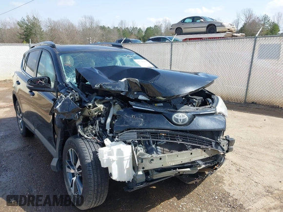 2018 Toyota RAV4 XLE with VIN 2T3WFREVXJW444002, listed as a IAAI auction lot 41795600 with 115,120 mi miles. Bid and sale history available at carsss.com. Image 6.